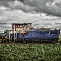 Buy canvas prints of Boat at Sunderland Point by Rob Howell