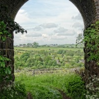Buy canvas prints of Winkhill village through an arch by Rob Howell