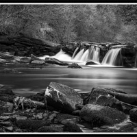 Buy canvas prints of Solitude at the Waterfall by Anthony Hucks