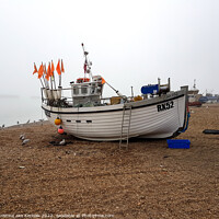 Buy canvas prints of White Boat on Misty Beach, Old Town, Hastings by Christine Kerioak
