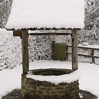 Buy canvas prints of Snow Covered Wishing Well by Christine Kerioak