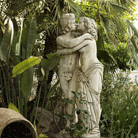 Buy canvas prints of Statue of Lovers Kissing in Garden by Christine Kerioak