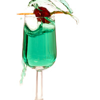 Buy canvas prints of Green Liqueur Escaping From Glass by Christine Kerioak