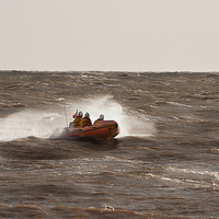 Buy canvas prints of Lifeboat coming towards the shore by Christine Kerioak