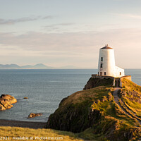 Buy canvas prints of Radiant Sunset over Llanddwyn Lighthouse by Andy McGarry