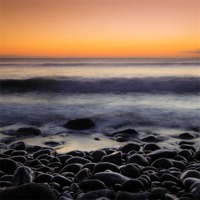 Buy canvas prints of Pebbles at Sunset by Andy McGarry