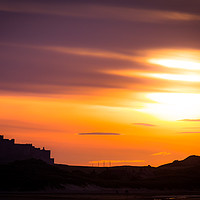 Buy canvas prints of Bamburgh Castle Sunset by Andy McGarry