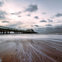 Buy canvas prints of Tranquil Sunrise over Bournemouth Pier by Daniel Rose