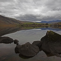 Buy canvas prints of  Reflections in a mountain Lake by Stephen Prosser