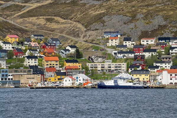 Colourful Houses in Honningsvåg in Arctic Norway. Picture Board by Martyn Arnold
