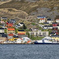 Buy canvas prints of Colourful Houses in Honningsvåg in Arctic Norway. by Martyn Arnold