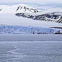 Buy canvas prints of Silent, Serene, Snowy Arctic Landscape Spitsbergen by Martyn Arnold
