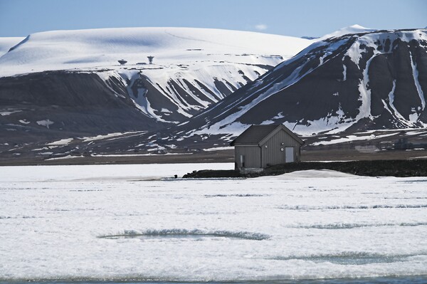 Frozen Lake and Mountains in Arctic Svalbard Picture Board by Martyn Arnold