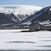 Buy canvas prints of Frozen Lake and Mountains in Arctic Svalbard by Martyn Arnold