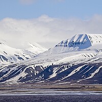 Buy canvas prints of Snow Covered Mountains on Arctic Spitsbergen by Martyn Arnold