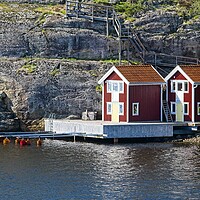 Buy canvas prints of Boathouses on Orust Island in Western Sweden by Martyn Arnold