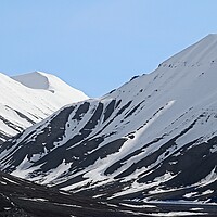 Buy canvas prints of Snowy Mountain Landscape in Svalbard by Martyn Arnold