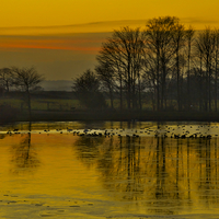 Buy canvas prints of  Winter Sunset on the Lake by Martyn Arnold