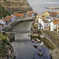Buy canvas prints of Staithes fishing village, Yorkshire Coast by Martyn Arnold
