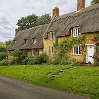 Buy canvas prints of Thatched Cottages Wadenhoe Village Northants by Martyn Arnold