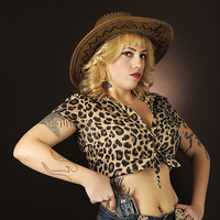 Buy canvas prints of Cowgirl pin-up with gun by Jean Gill