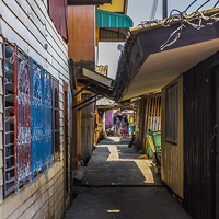 Buy canvas prints of Side street of Koh Panyee, thailand by colin chalkley
