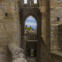 Buy canvas prints of  A View Through an Arch at Carcassone by colin chalkley