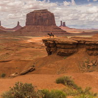 Buy canvas prints of  A Lone Horseman in Monument Valley, USA by colin chalkley