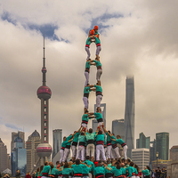 Buy canvas prints of  Castellers on the Bund in Shanghai by colin chalkley