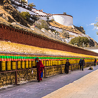 Buy canvas prints of Prayer Wheels at the Potala Palace by colin chalkley