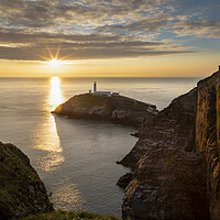 Buy canvas prints of Sunset on South Stack lighthouse by Leighton Collins