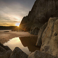 Buy canvas prints of Sunset at Three Cliffs Bay by Leighton Collins