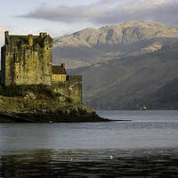 Buy canvas prints of Eilean Donan Castle and mountains by Leighton Collins