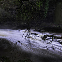 Buy canvas prints of A fast flowing waterfall by Leighton Collins