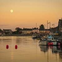 Buy canvas prints of Dungarvan Harbour Sunset by Leighton Collins