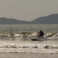 Buy canvas prints of  Surfing Llangennith beach by Leighton Collins