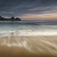 Buy canvas prints of  Sunset at Three Cliffs Bay Gower by Leighton Collins