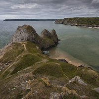 Buy canvas prints of  Three Cliffs Bay and the Great Tor by Leighton Collins