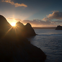 Buy canvas prints of Sunset at Three Cliffs Bay by Leighton Collins