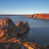 Buy canvas prints of Rugged Three Cliffs Bay and the Great Tor by Leighton Collins