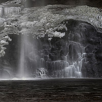 Buy canvas prints of Henrhyd Falls in Winter by Leighton Collins