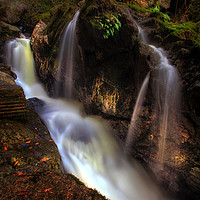Buy canvas prints of Waterfall behind Dinas Rock by Leighton Collins