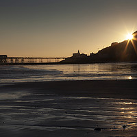 Buy canvas prints of Starburst sunrise at Mumbles Pier by Leighton Collins