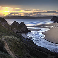 Buy canvas prints of Sunset at Three Cliffs Bay Gower by Leighton Collins