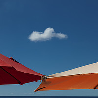 Buy canvas prints of A solo cloud and parasols by Leighton Collins
