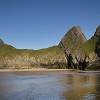Buy canvas prints of The rugged Three Cliffs Bay by Leighton Collins