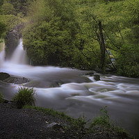 Buy canvas prints of Swollen waterfall at Penllergare Valley Woods by Leighton Collins