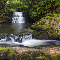 Buy canvas prints of The waterfall behind Dinas Rock by Leighton Collins