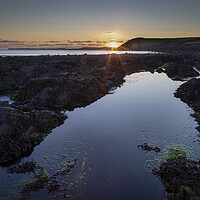 Buy canvas prints of Rockpools on Manorbier beach by Leighton Collins