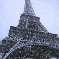 Buy canvas prints of Majestic Eiffel Tower in Winter Wonderland by Les McLuckie